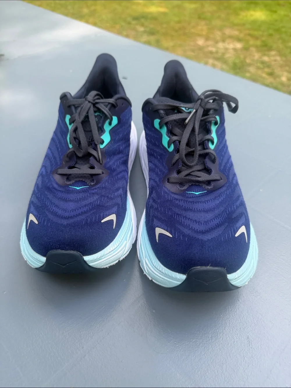 Hoka Navy Running Shoes with Aqua Accents. Wide shoes